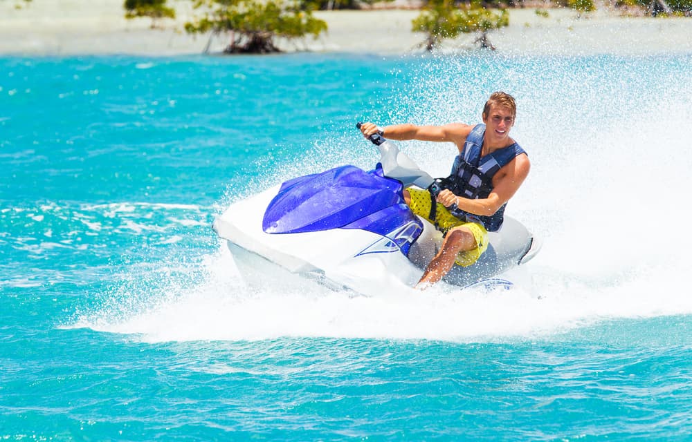 person riding jet ski