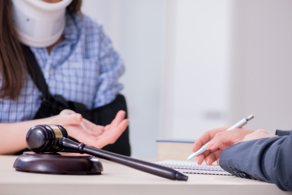 injured woman meeting with lawyer