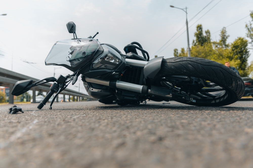 motorcycle laying in the road after an accident