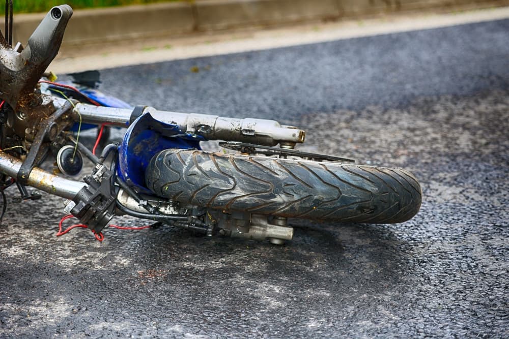 Road accident involving a motorcyclist and a passenger car.